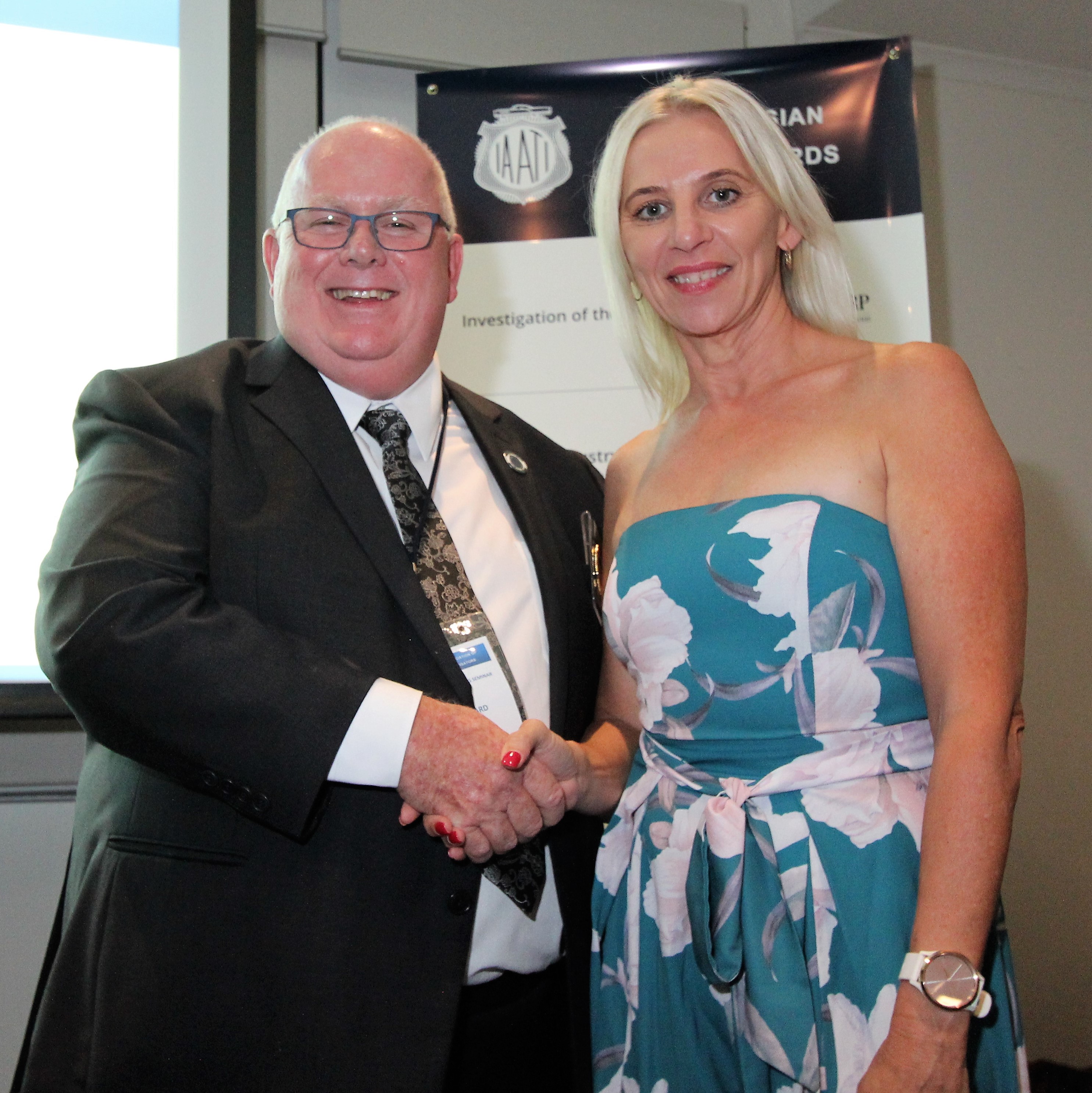 Catherine Horton 2019 AB Travel Scholarship winner, receiving her awards from Award Sponsor and Australasian Branch President, Mark Pollard (F.I.R.E.S)