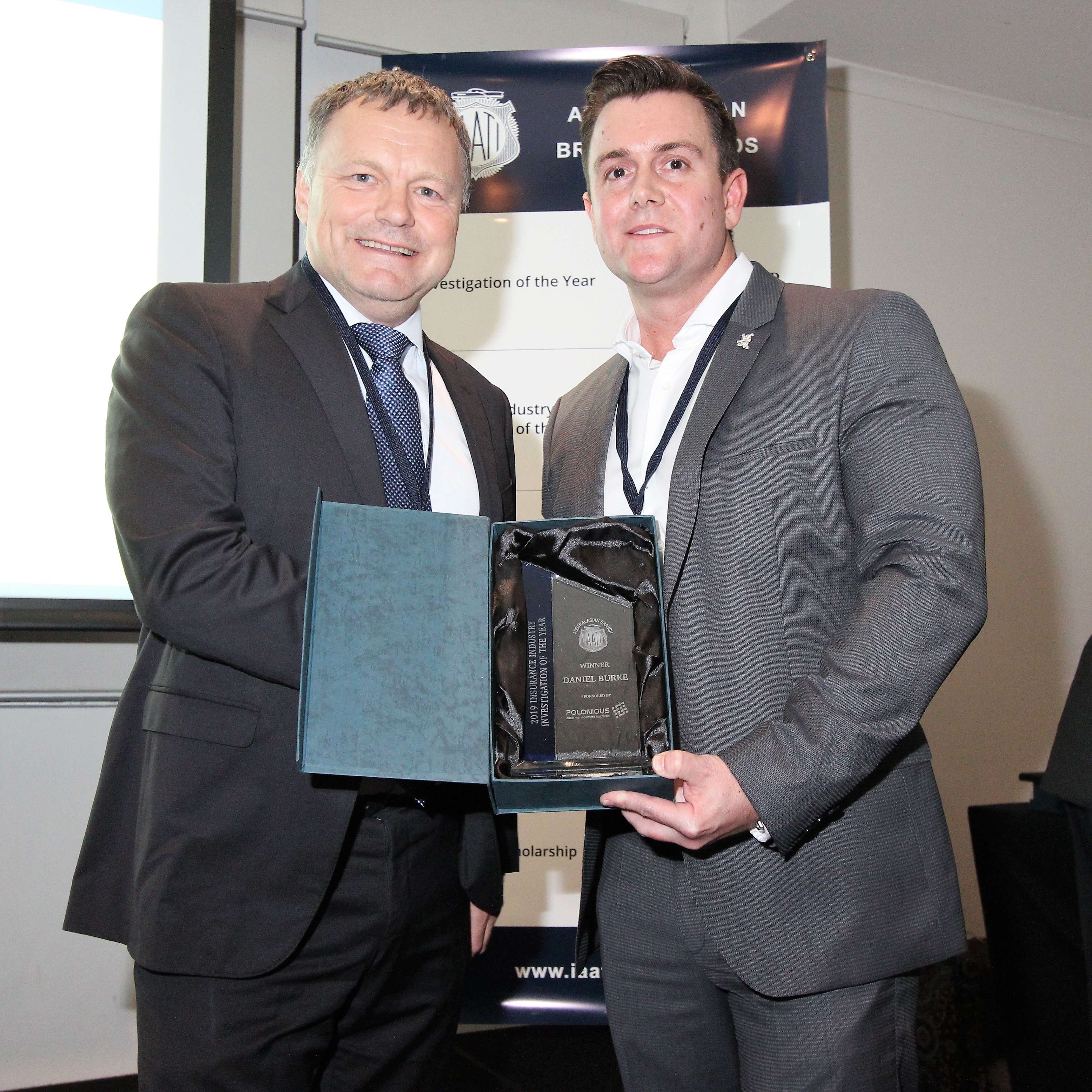 Daniel Burke (right) receiving the 2019 Insurance Investigation of the Year award from Award Sponsor, Stuart Guthrie (left) Co-CEO of Polonious.