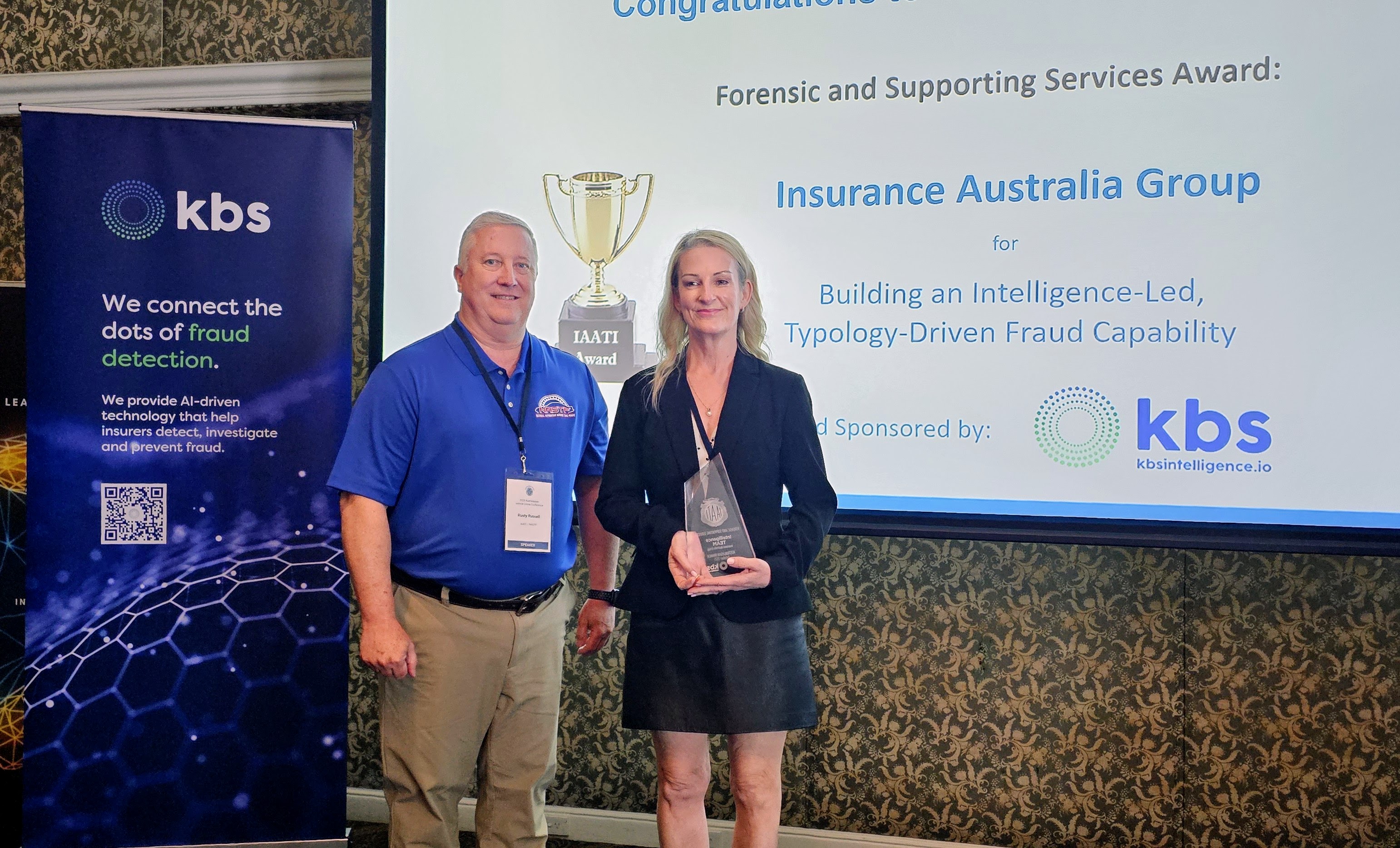 International IAATI 1st Vice President, Rusty Russell presenting award to Janeen Cole, Insurance Australia Group